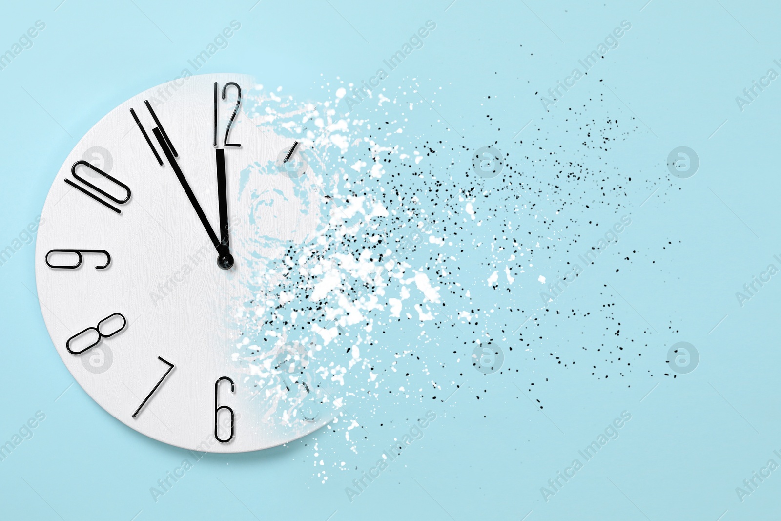 Time running out. Clock dissolving on light blue background Image of Time running out. Clock dissolving on light blue background