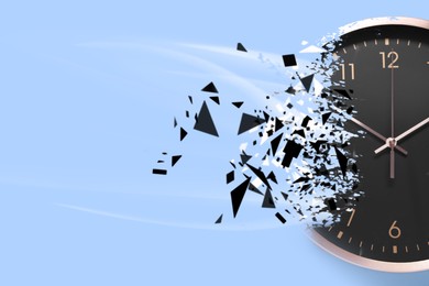 Image of Time running out. Clock dissolving on light blue background