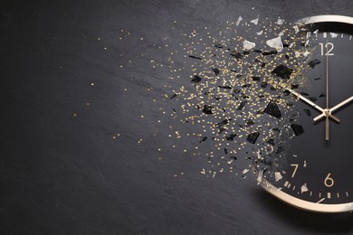 Image of Time running out. Clock dissolving on grey textured background