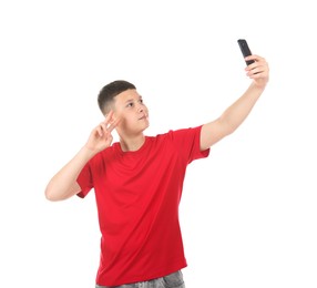 Photo of Teenage boy taking selfie on white background