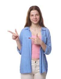 Photo of Teenage girl pointing at something on white background