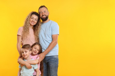 Photo of Happy family on yellow background. Space for text