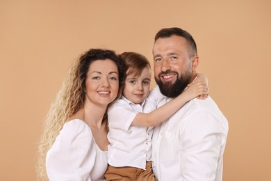 Photo of Portrait of happy family on beige background