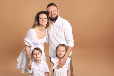 Photo of Portrait of happy family on beige background