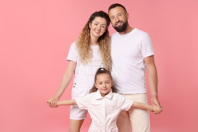 Photo of Portrait of happy family on pink background