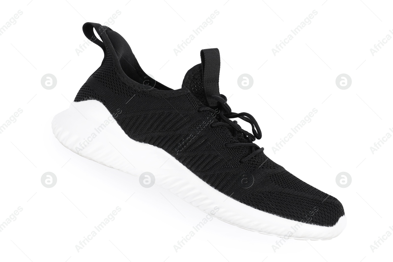 Photo of One stylish black sneaker on white background, top view