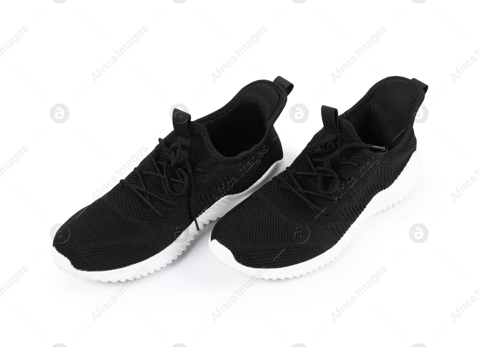 Pair of stylish black sneakers on white background Photo of Pair of stylish black sneakers on white background