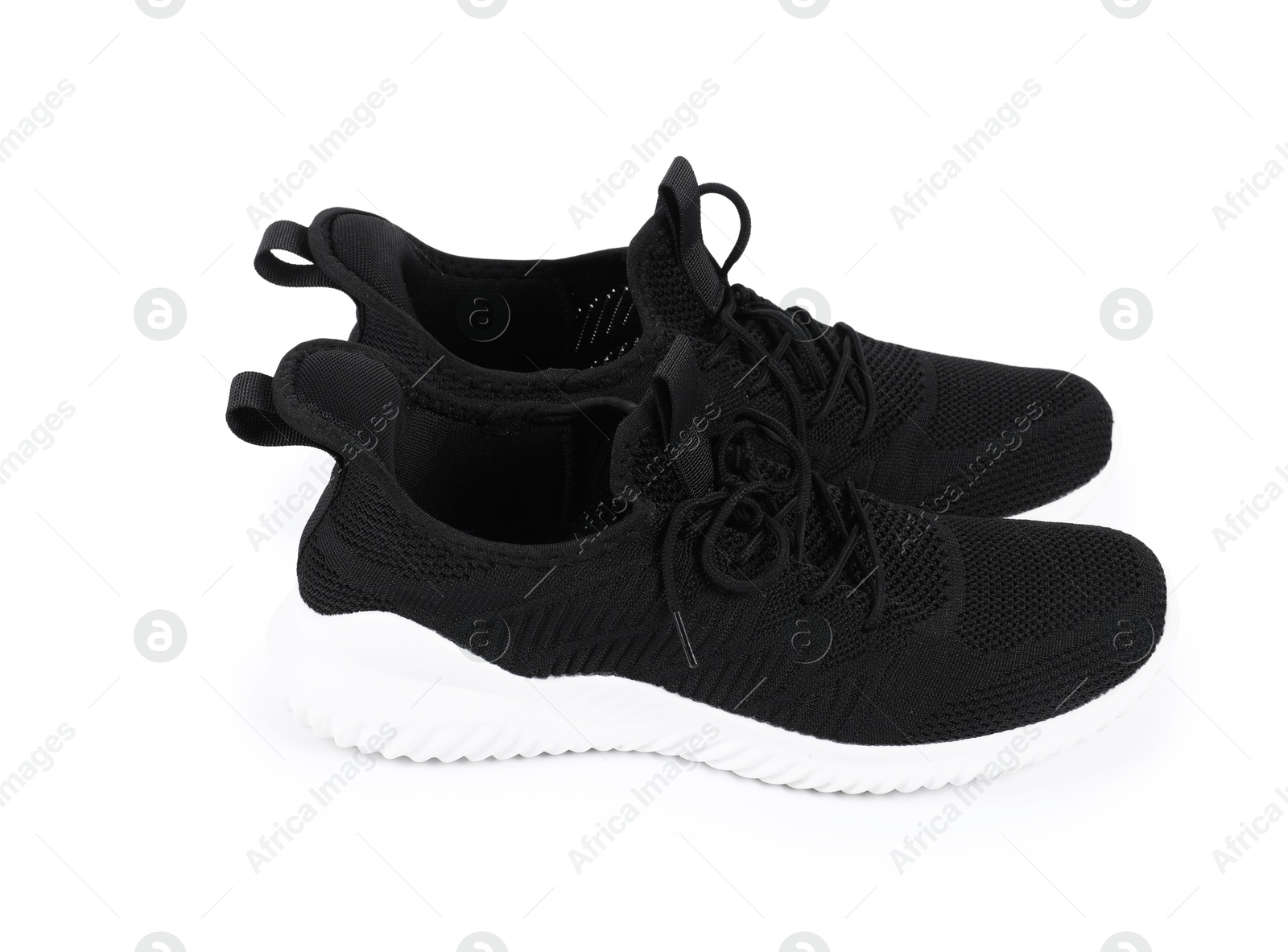 Photo of Pair of stylish black sneakers on white background