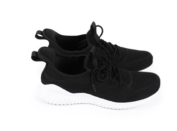 Photo of Pair of stylish black sneakers on white background