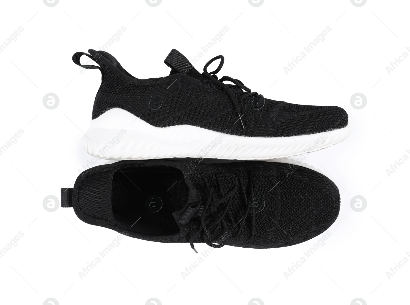 Photo of Pair of stylish black sneakers on white background, top view