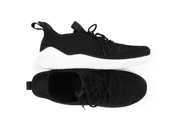 Photo of Pair of stylish black sneakers on white background, top view