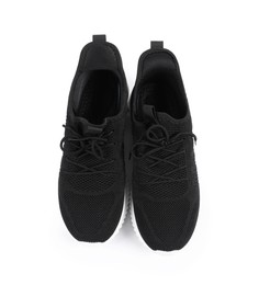Photo of Pair of stylish black sneakers on white background, top view