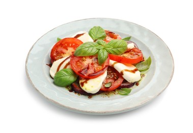 Photo of Tasty salad Caprese with mozzarella, tomatoes, basil and spices isolated on white