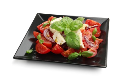 Photo of Tasty salad Caprese with mozzarella, tomatoes, basil, onion and spices isolated on white