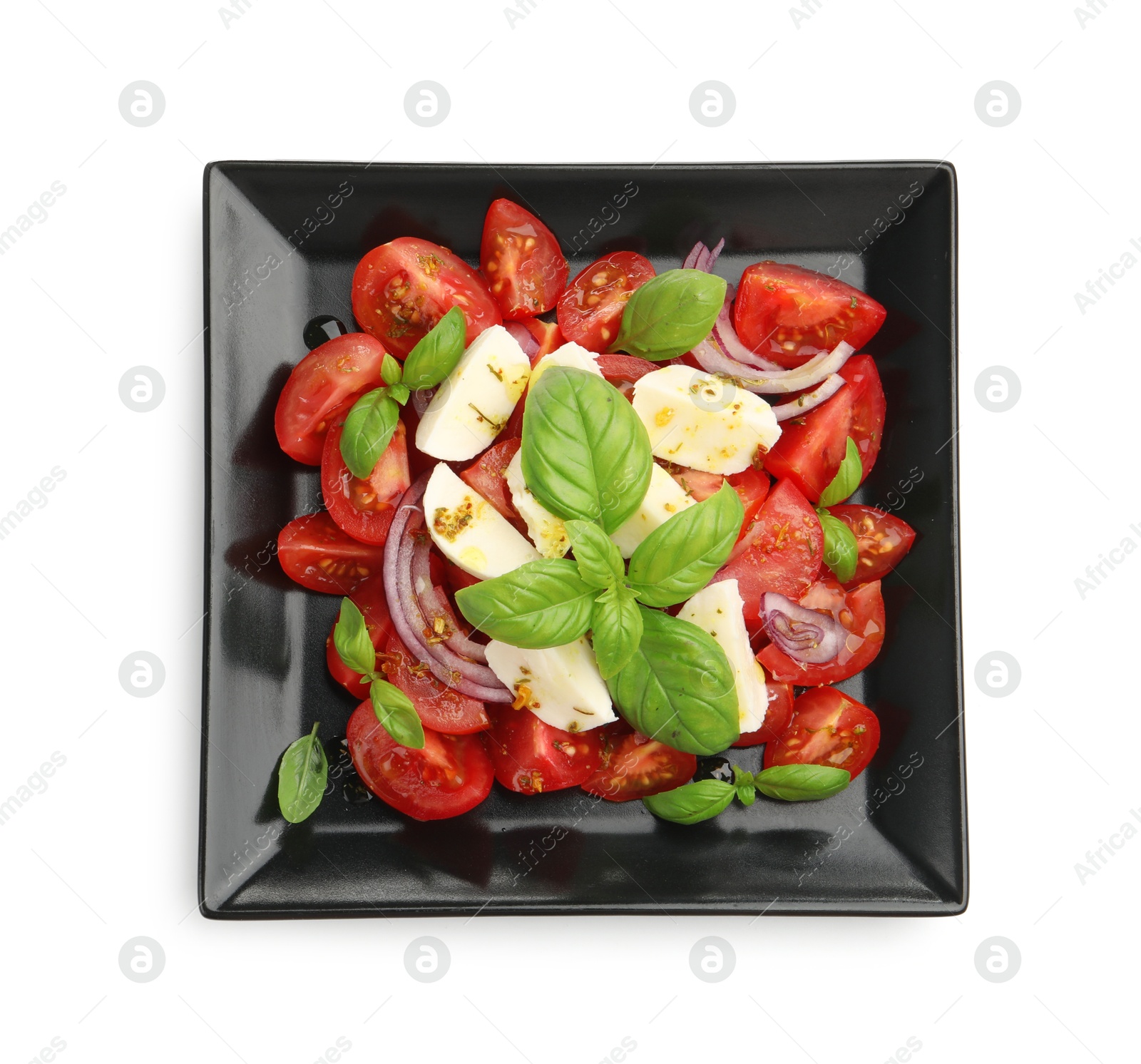 Tasty salad Caprese with mozzarella, tomatoes, basil, onion and spices isolated on white, top view Photo of Tasty salad Caprese with mozzarella, tomatoes, basil, onion and spices isolated on white, top view