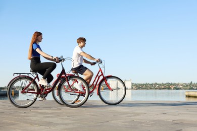 Photo of Teenage girl and boy riding bicycles outdoors
