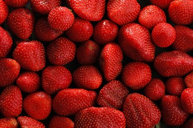 Photo of Fresh ripe strawberries as background, top view