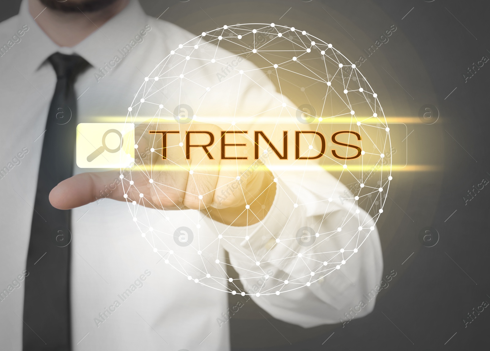 Image of Businessman using virtual screen to find hot tendencies, new ideas, popular directions against grey background, closeup. Search bar with word Trends and globe