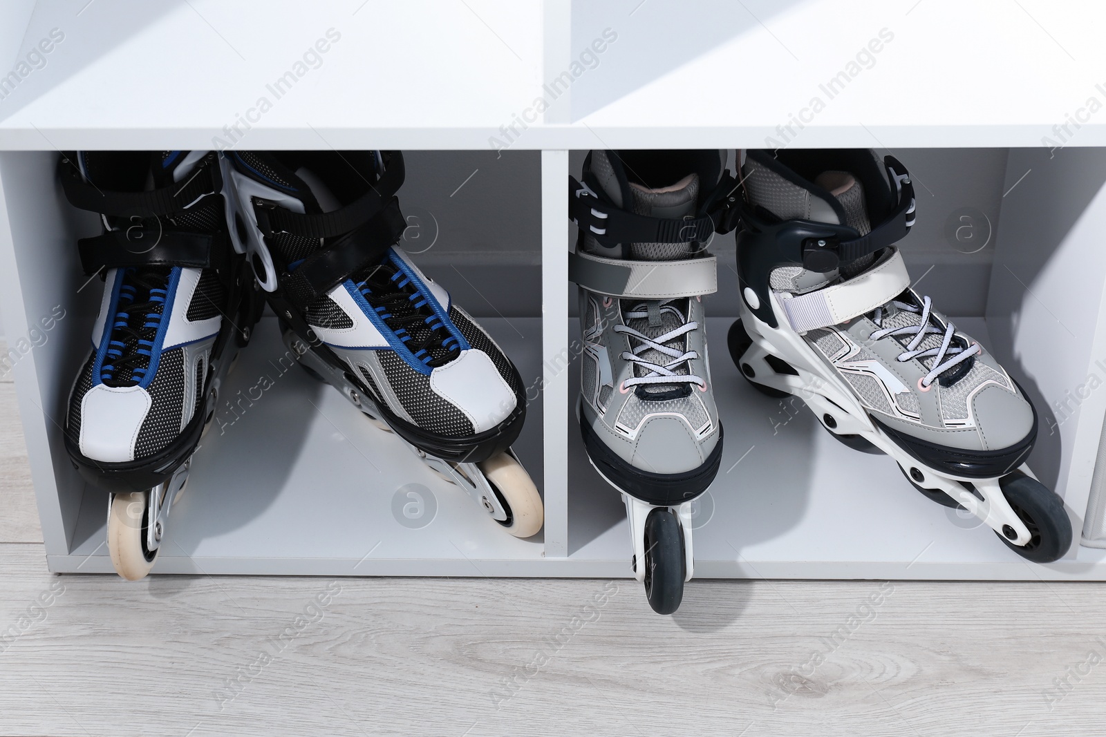 Photo of Pairs of roller skates in shelving unit