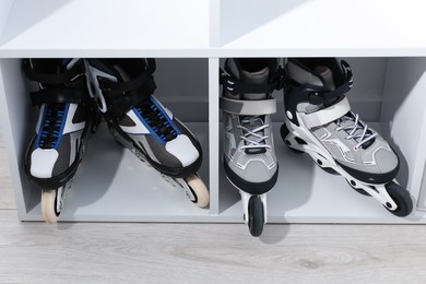 Photo of Pairs of roller skates in shelving unit