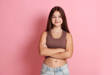Photo of Portrait of teenage girl on pink background