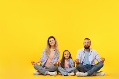 Photo of Happy family on yellow background. Space for text
