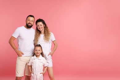Photo of Portrait of happy family on pink background. Space for text