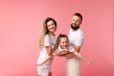 Photo of Portrait of happy family on pink background