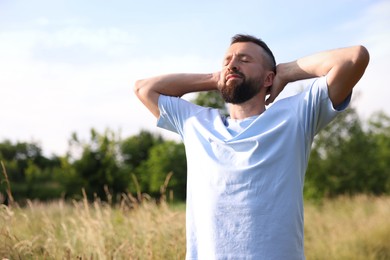 Photo of Feeling freedom. Man enjoying time outdoors. Space for text