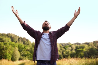 Photo of Feeling freedom. Happy man enjoying time outdoors