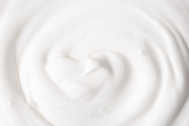 Photo of Texture of tasty yogurt as background, top view