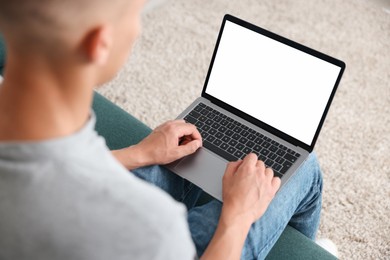Photo of Man having online consultation with doctor via laptop at home, above view