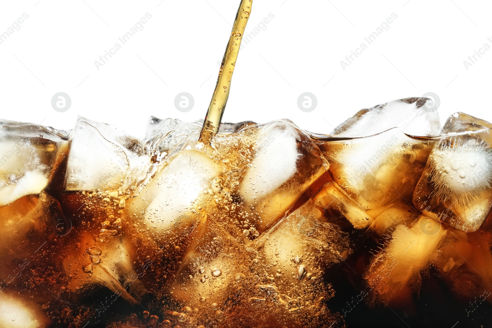 Photo of Pouring refreshing cola into glass with ice isolated on white