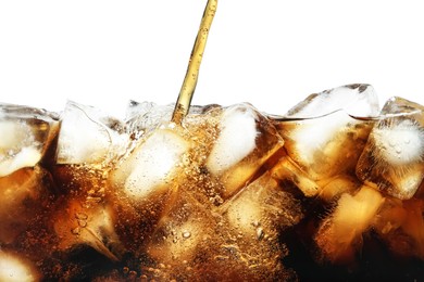 Photo of Pouring refreshing cola into glass with ice isolated on white