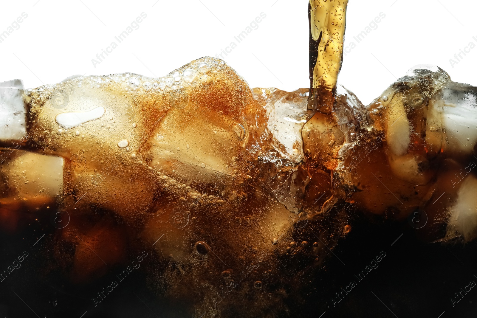 Photo of Pouring refreshing cola into glass with ice isolated on white