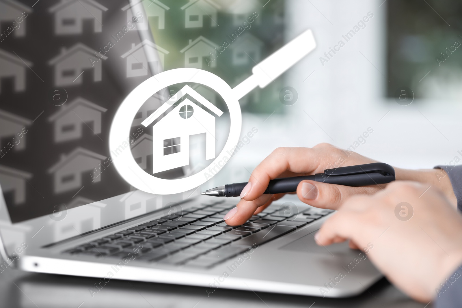 Real estate agent using laptop at table, closeup. Magnifying glass and house icons on virtual screen Image of Real estate agent using laptop at table, closeup. Magnifying glass and house icons on virtual screen