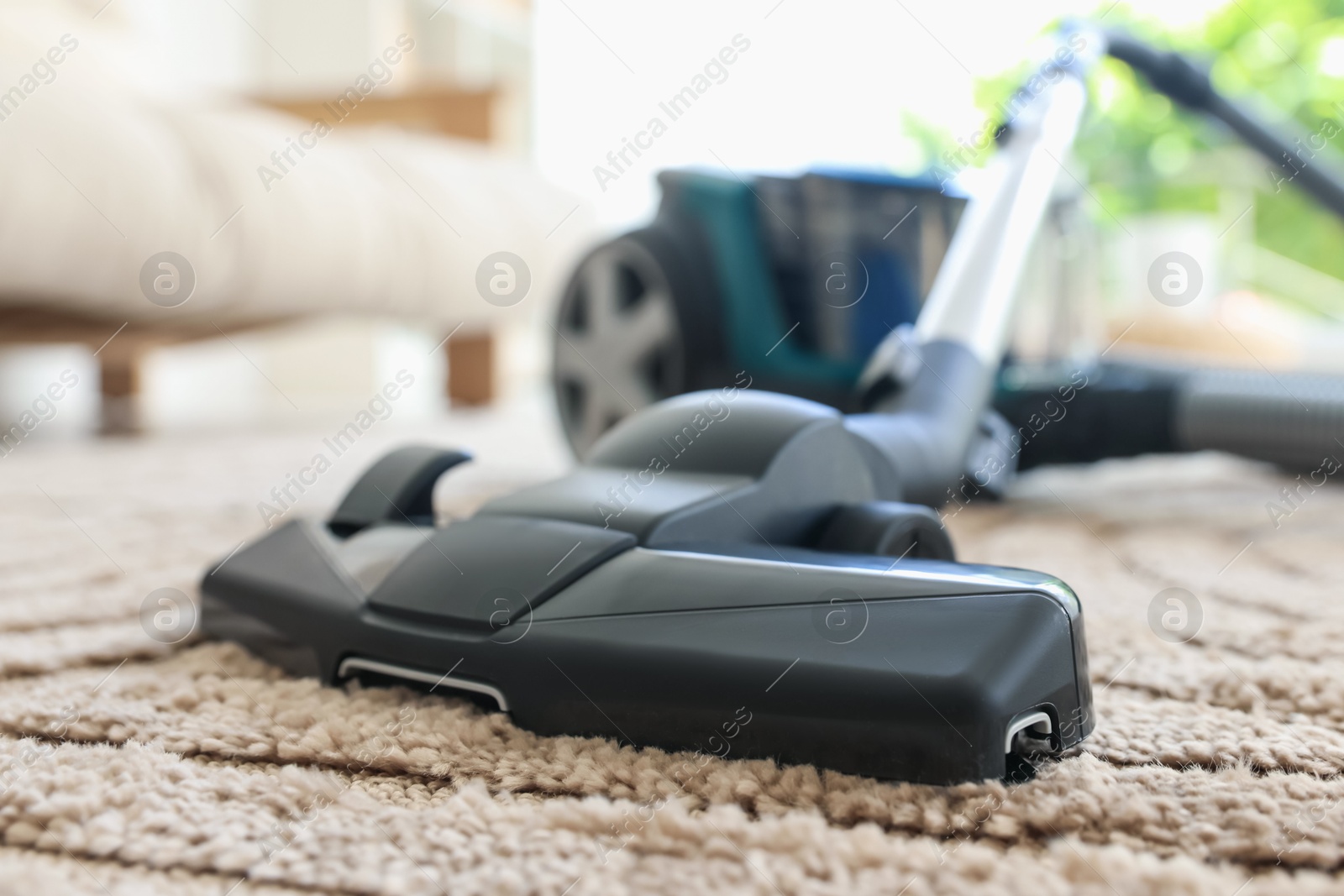 One vacuum cleaner on floor indoors, closeup Photo of One vacuum cleaner on floor indoors, closeup