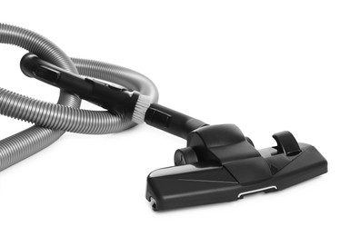 Photo of Vacuum cleaner brush and hose on white background
