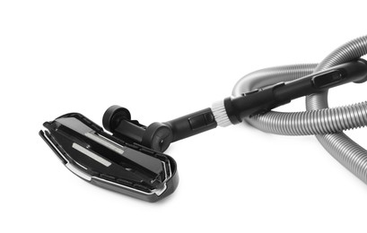 Photo of Vacuum cleaner brush and hose on white background