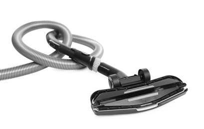 Photo of Vacuum cleaner brush and hose on white background