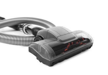 Photo of Vacuum cleaner brush and hose on white background