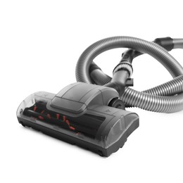 Photo of Vacuum cleaner brush and hose on white background