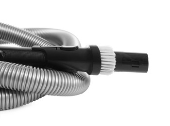 Photo of Vacuum cleaner brush and hose on white background