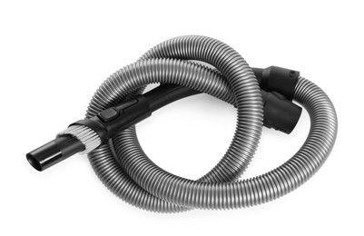 Photo of Vacuum cleaner brush and hose on white background, top view