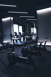 Photo of Many modern professional bicycle machines in gym