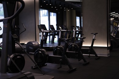 Photo of Many modern professional bicycle machines in gym