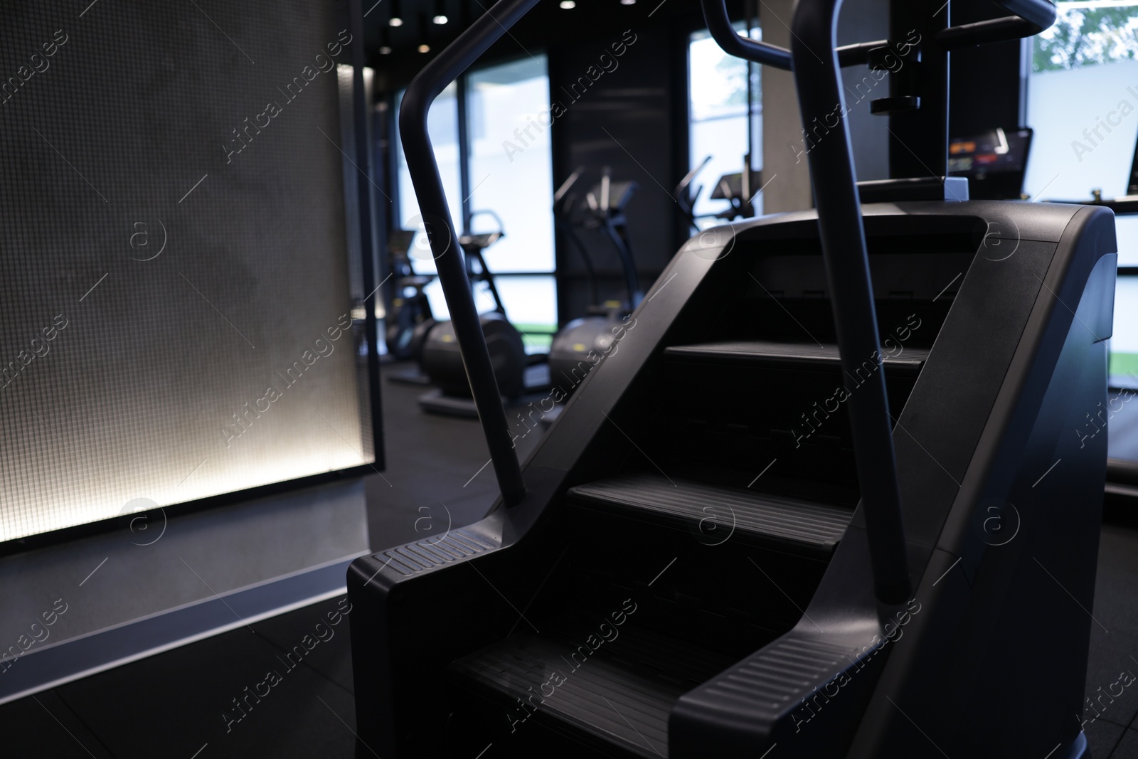 Professional stair climber machine in gym. Healthy lifestyle Photo of Professional stair climber machine in gym. Healthy lifestyle