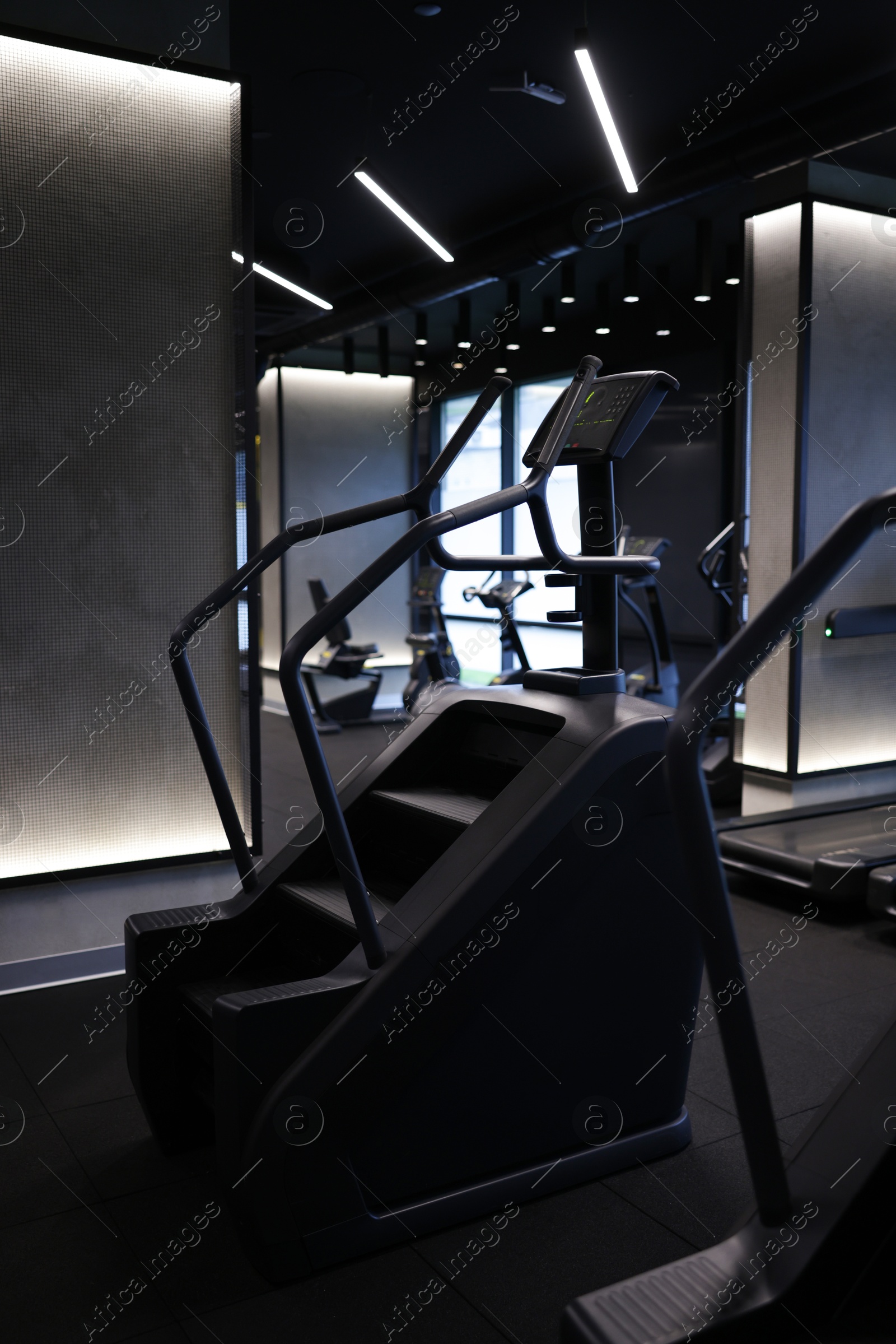Professional stair climber machine in gym. Healthy lifestyle Photo of Professional stair climber machine in gym. Healthy lifestyle