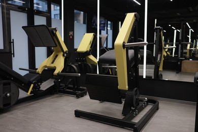 Photo of Different exercise equipment in professional gym. Healthy lifestyle