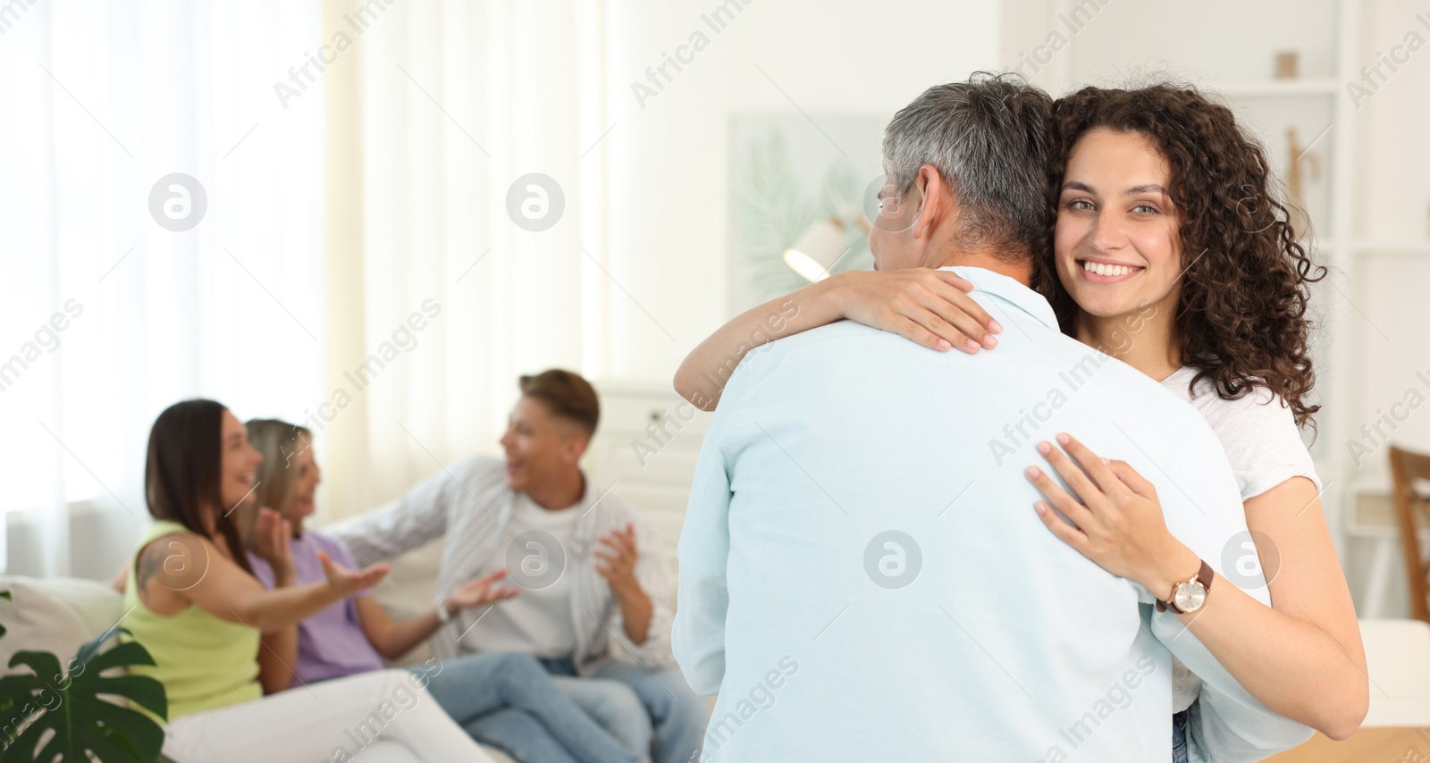 Happy friends hugging at home, selective focus Photo of Happy friends hugging at home, selective focus